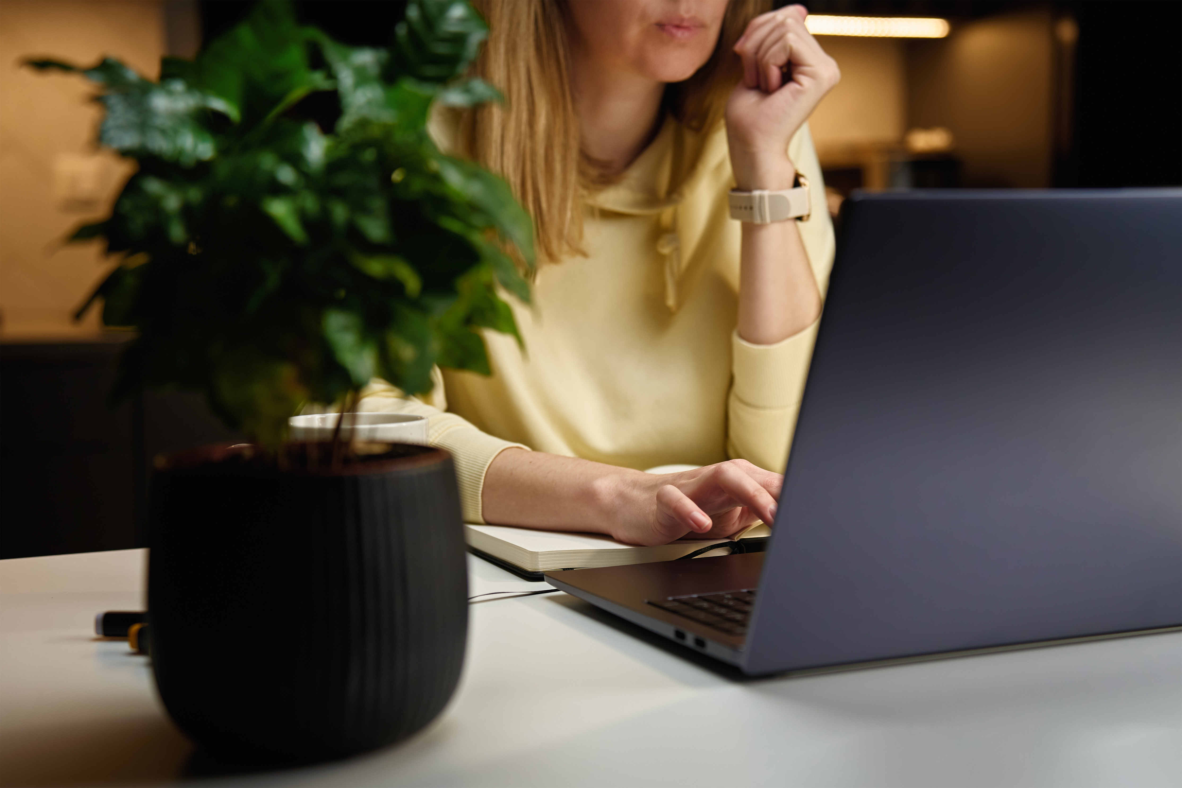 woman-at-home-workplace-using-laptop-at-night