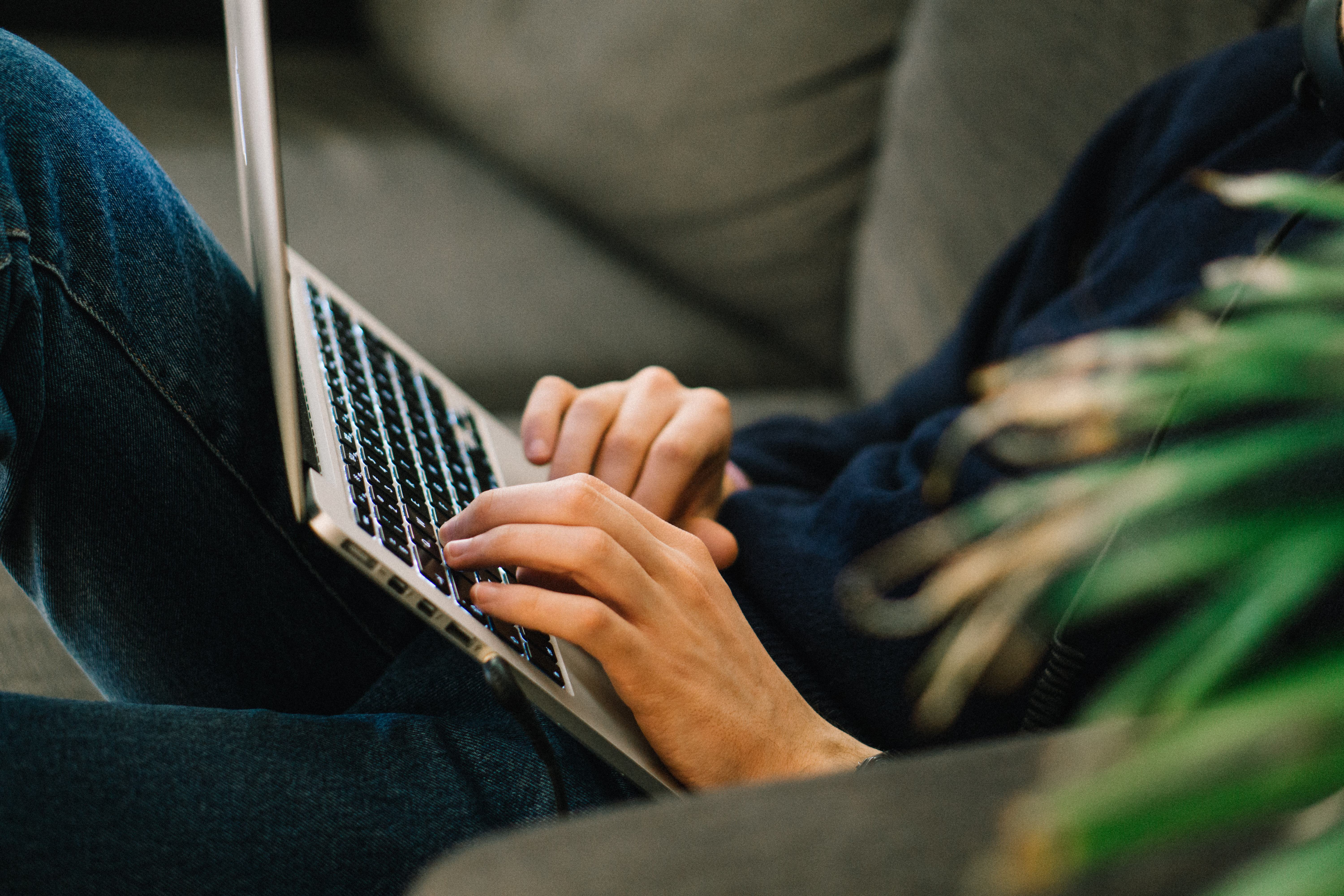midsection-man-using-laptop-while-reclining-sofa-home-2