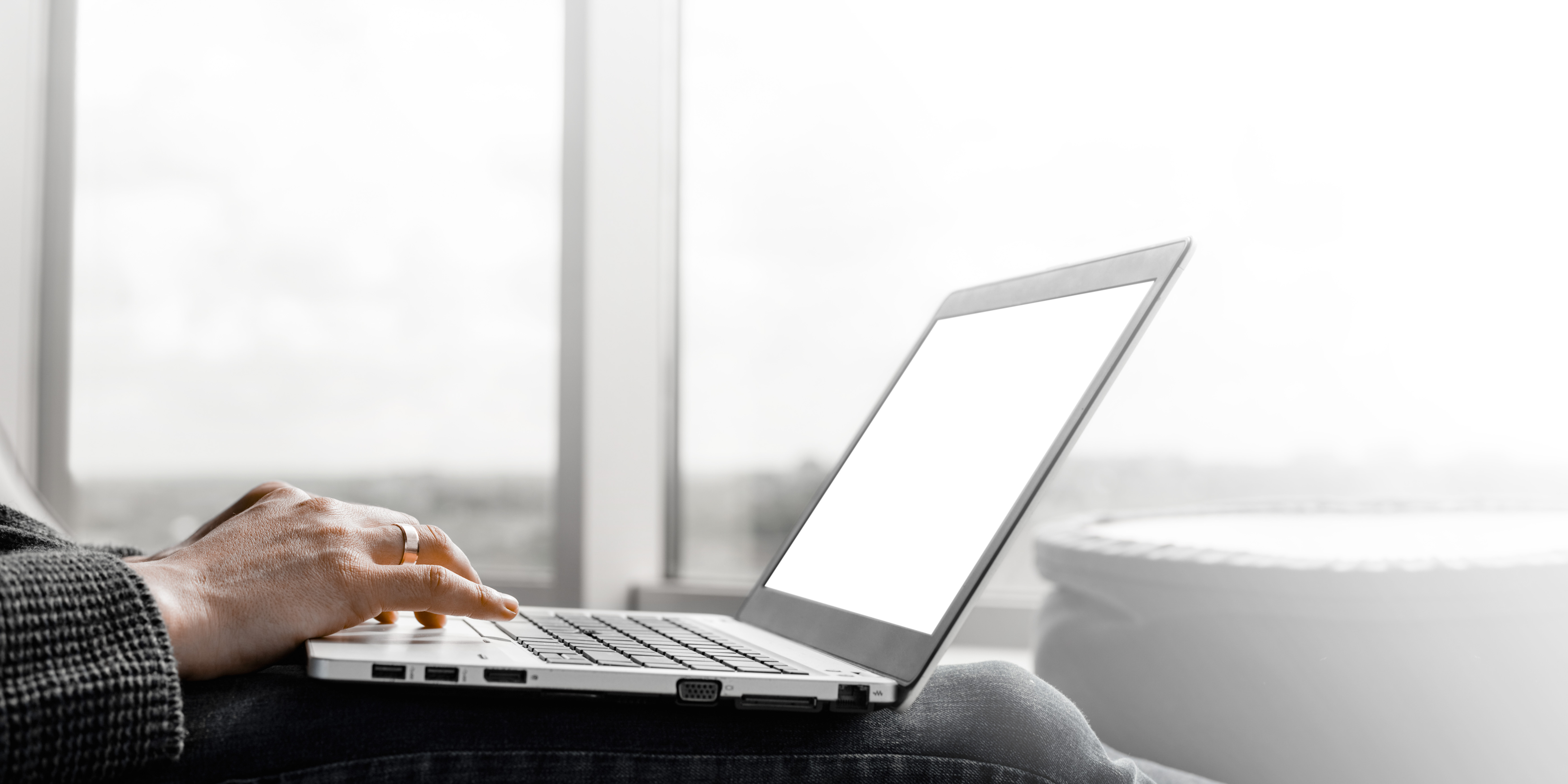 a-businessman-working-in-an-office-with-large-windows-2