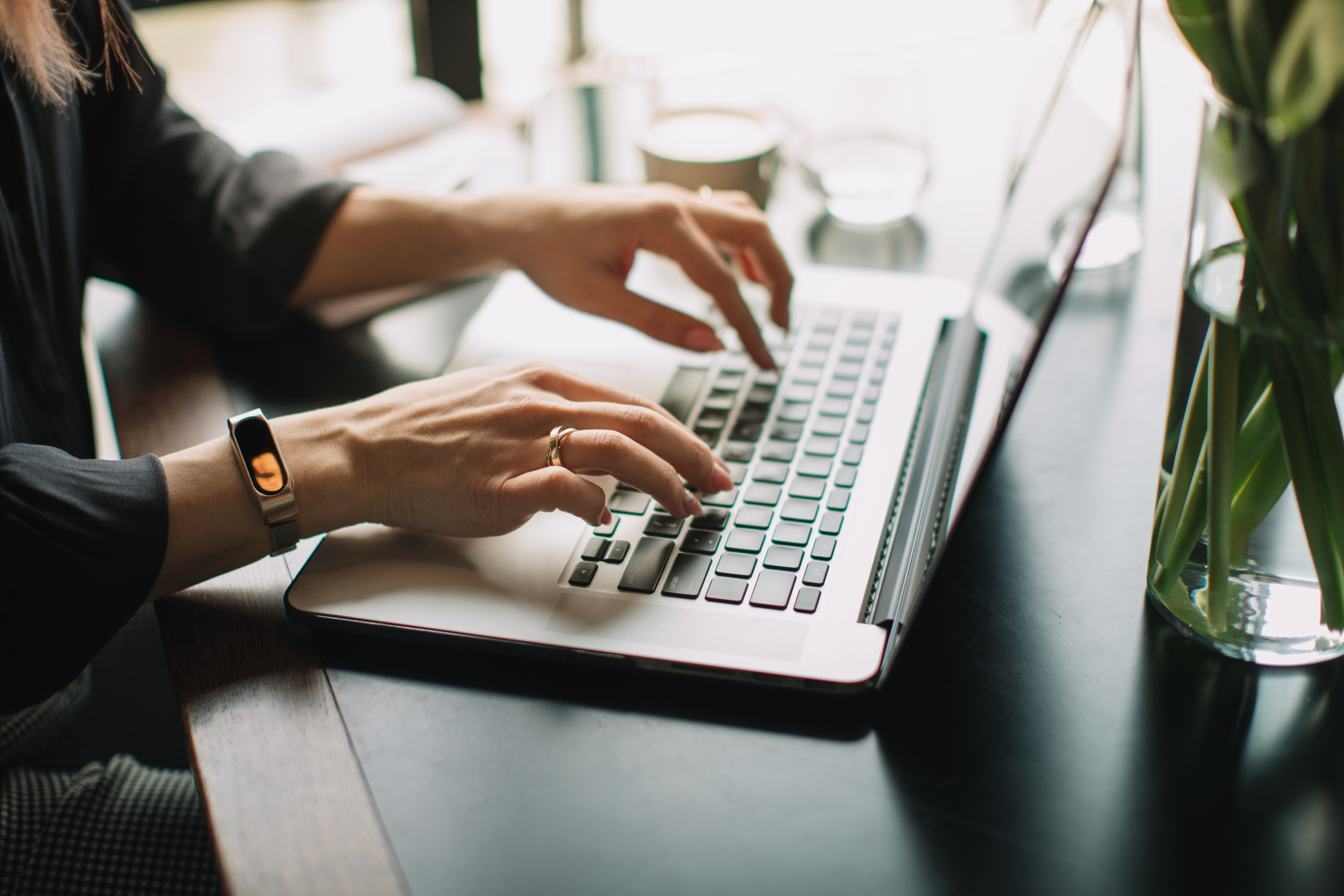 midsection-woman-using-laptop-desk-1
