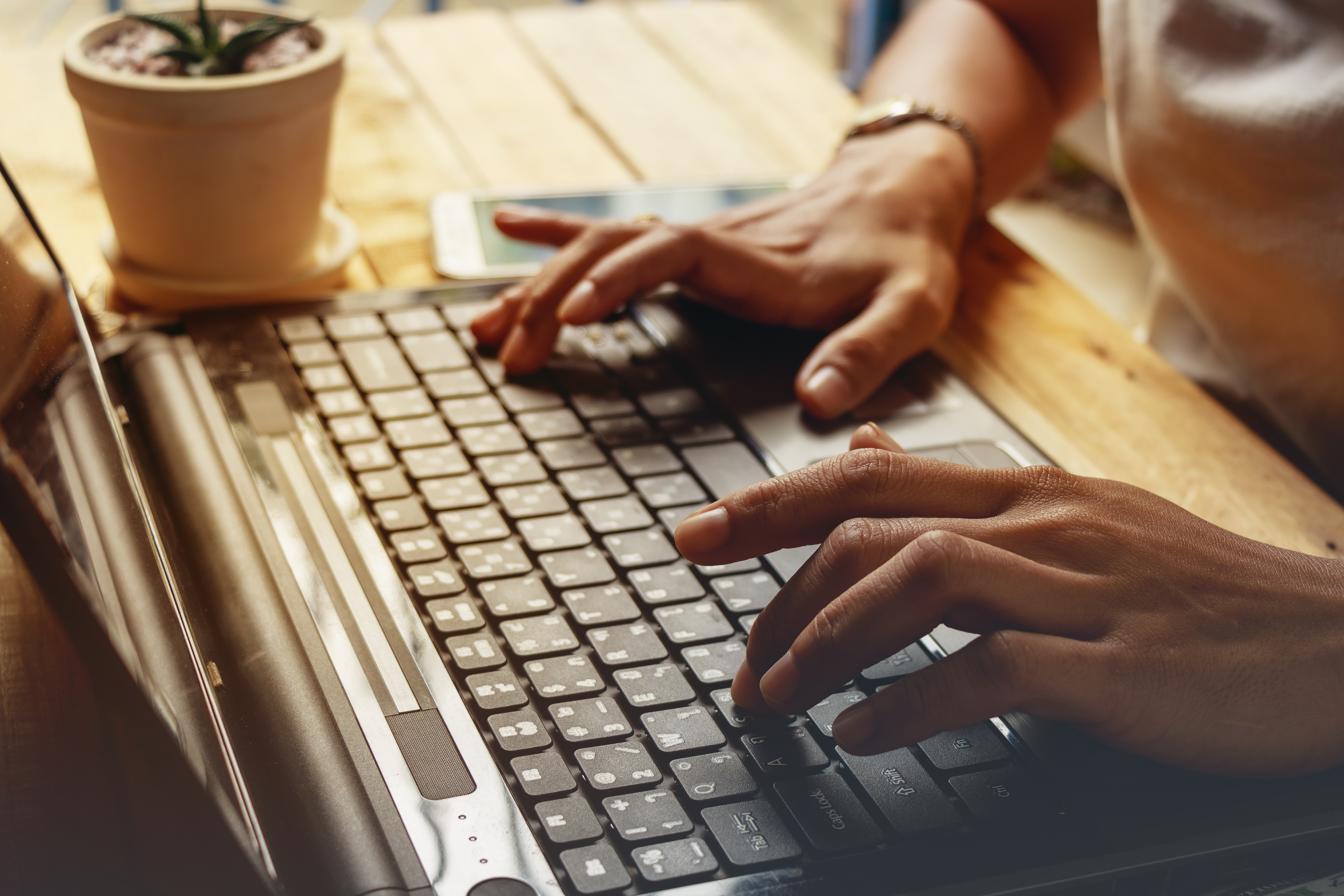woman-using-laptop-table
